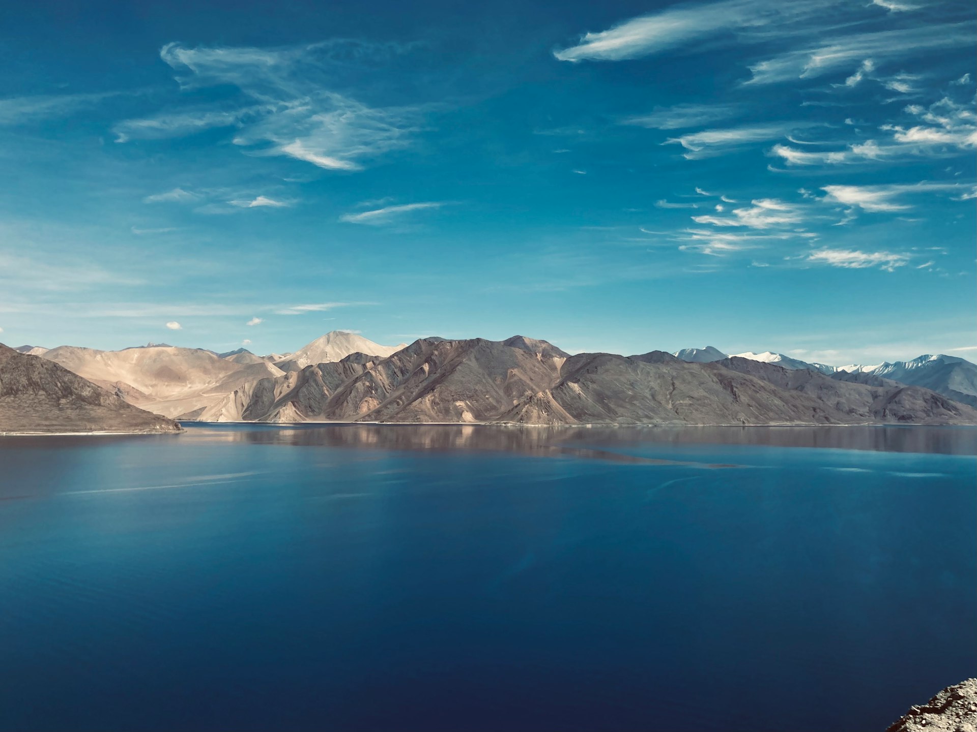 a large body of water surrounded by mountains